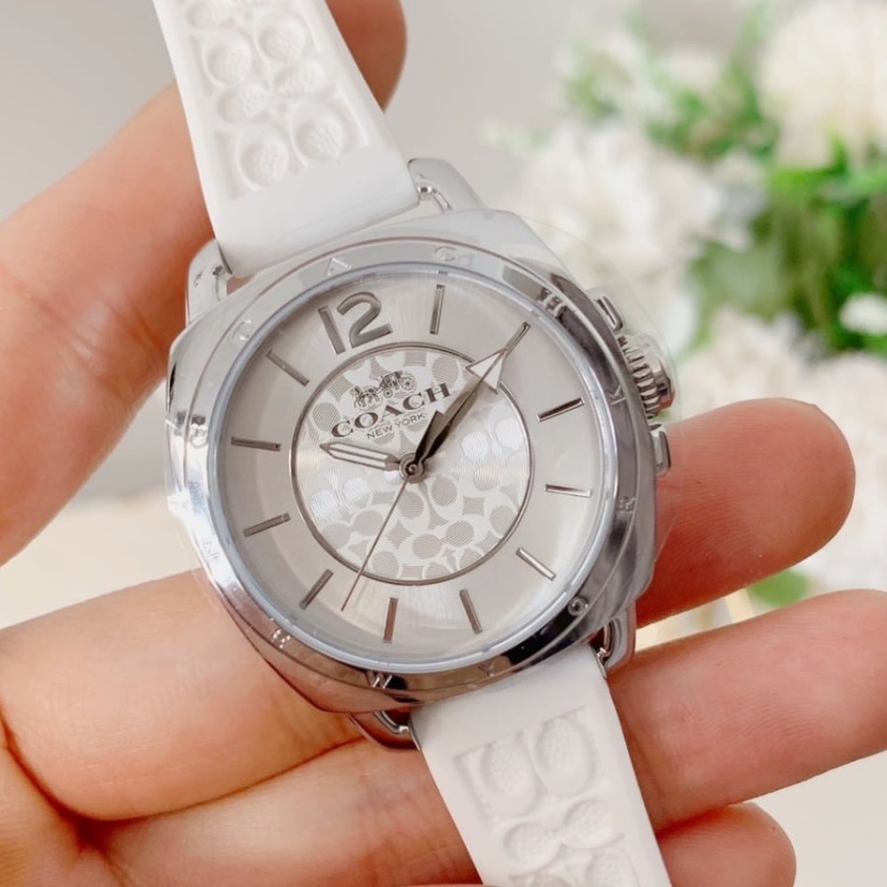 A white coach watch, size is medium, color is white and the brand is Coach